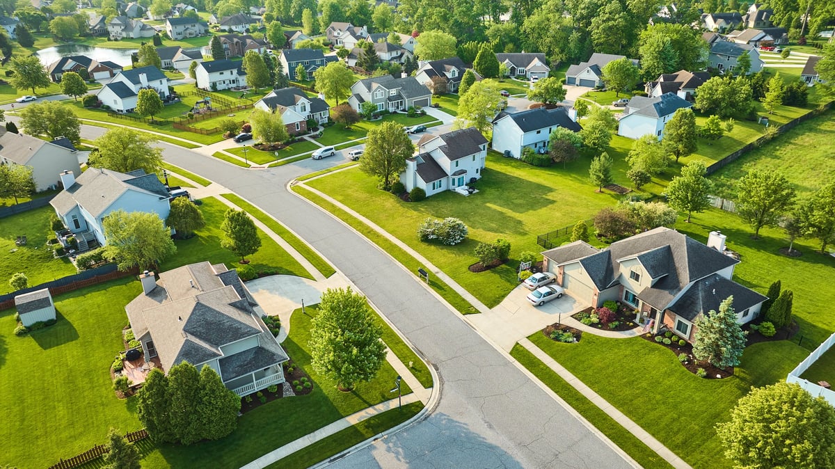 Aerial view of residential neighbourhood and homes in Cambridgeshire showing the area served by our local property surveyors